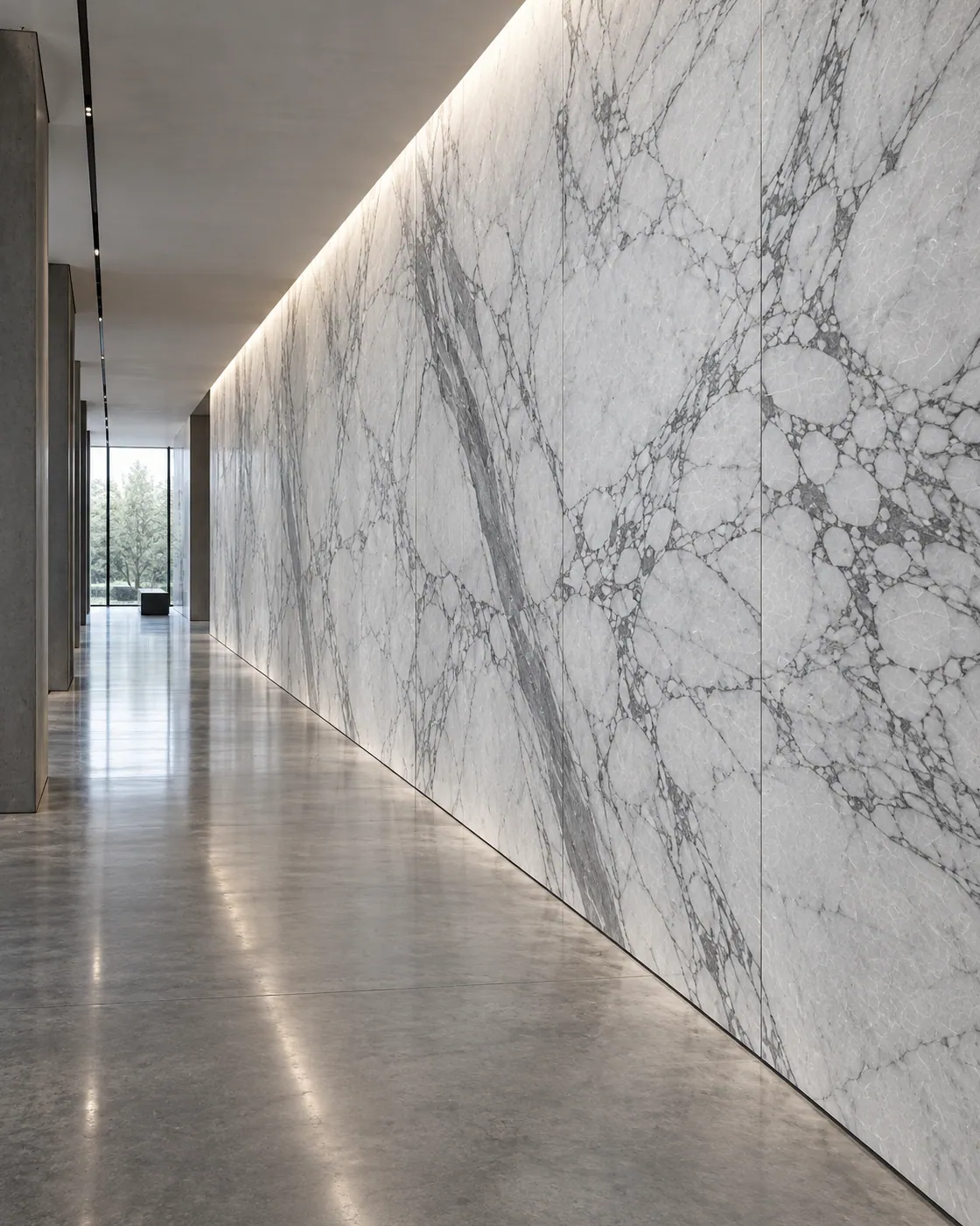 Visualisation: a long corridor whose full-height wall is clad in white veined stone, washed by light from a ceiling slot.