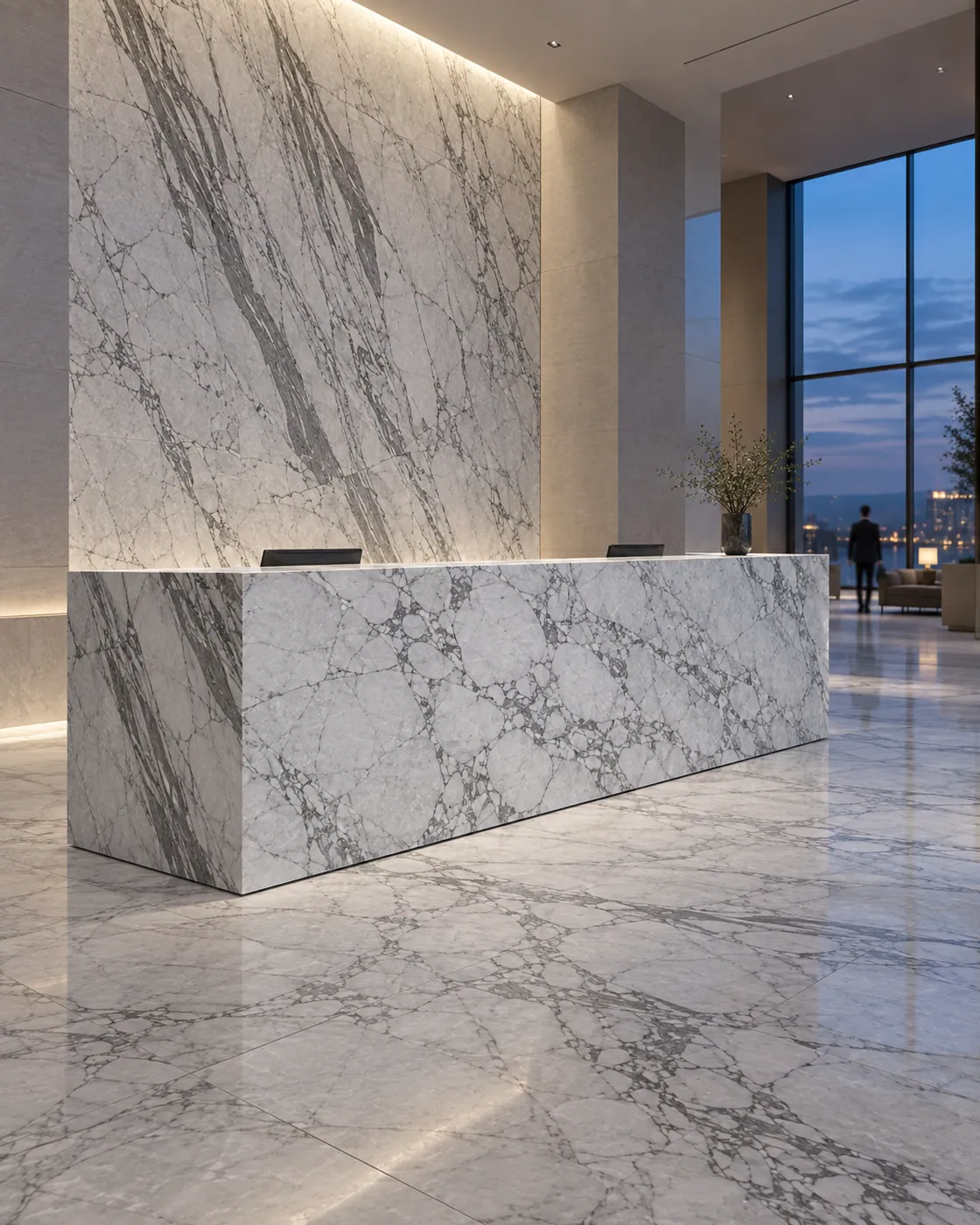 Visualisation: a hotel lobby with a reception desk of white veined stone on a stone floor.